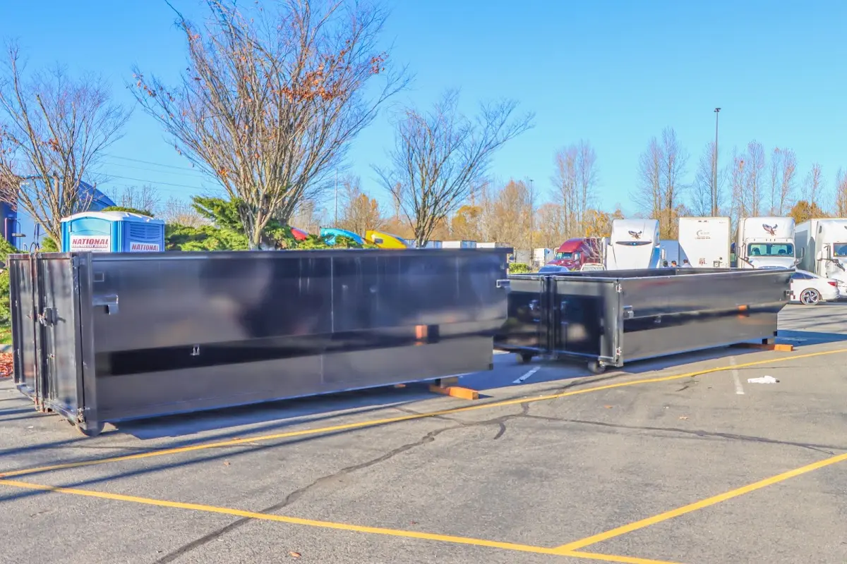 Professional dumpster rental service with roll-off container on residential driveway in Cincinnati
